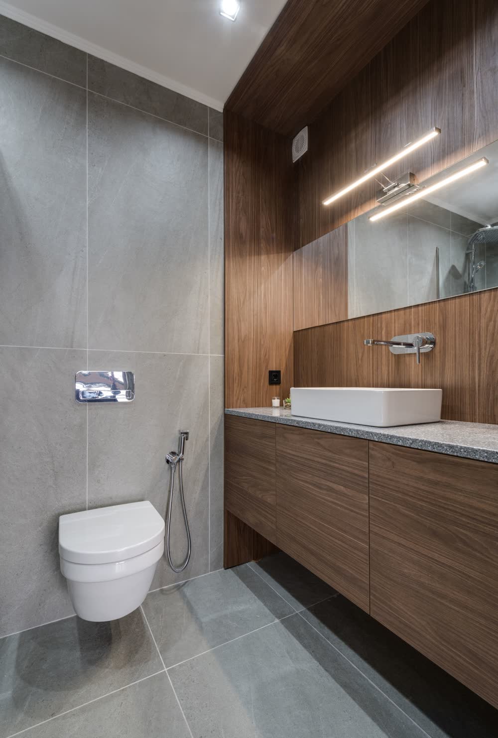 Walnut bathroom vanity with a vessel sink