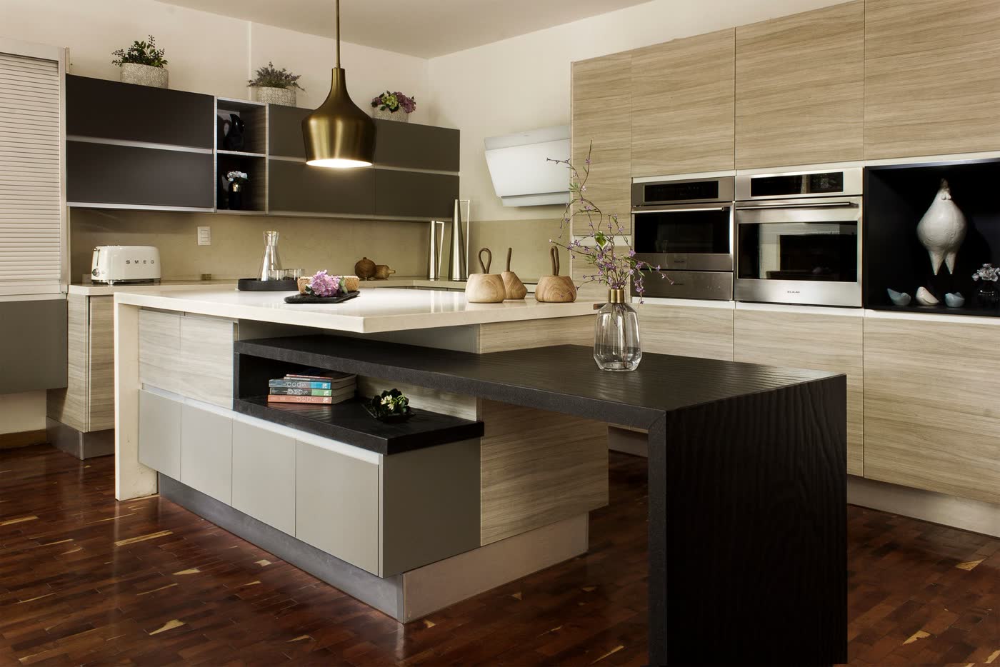 Modern kitchen with wood grain cabinets and a dark island